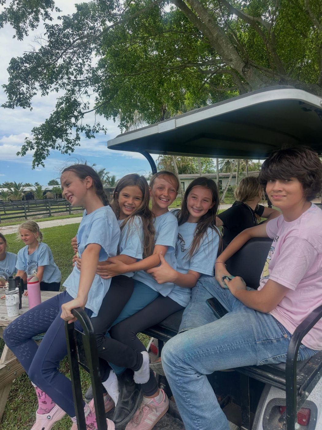 A crew of campers piled onto the golf cart